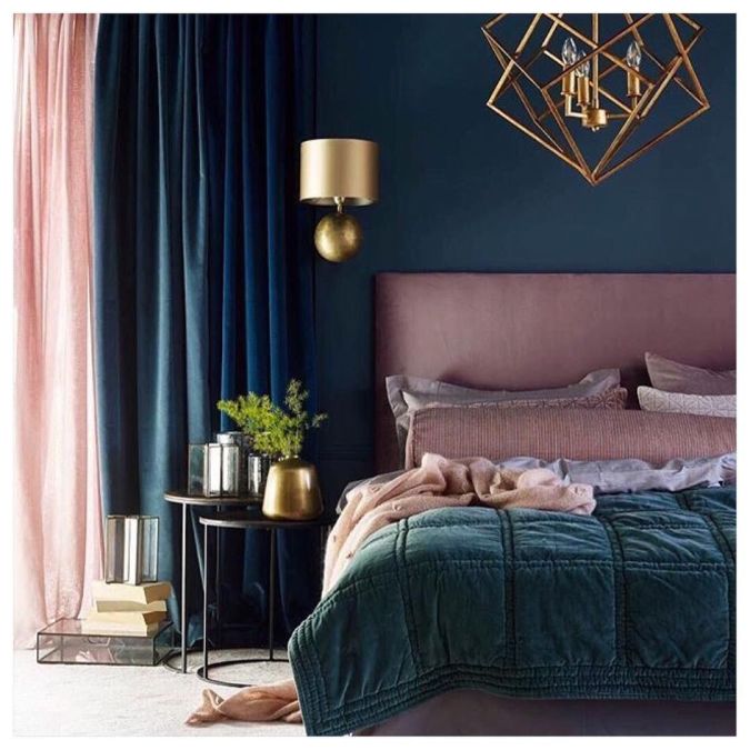 Sweet Dreams: Our 2020 Bedroom Interior Trend Predictions by Fashion Du Jour LDN. Close-up of teal painted wall, brushed chrome light fittings and lamps, blush pink upholstered bed, teal velvet throws, teal, navy and blush pink bedroom interior