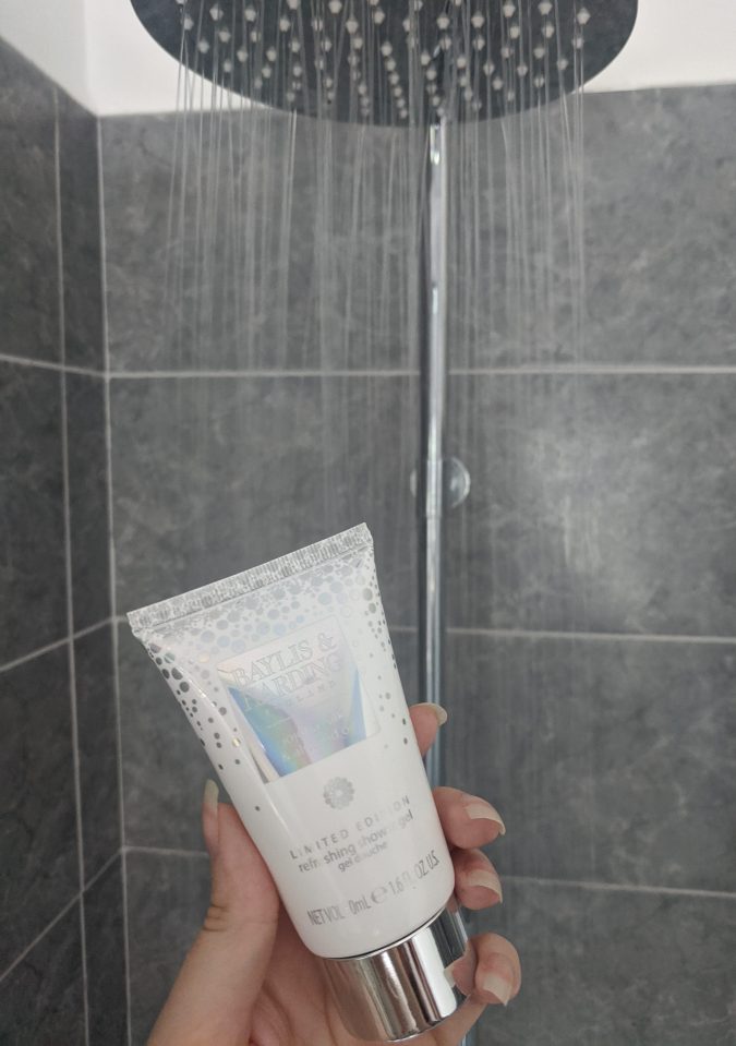 Pandemic Pampering How To Lockdown Your Winning Morning Routine by Fashion Du Jour LDN. Grey bathroom with grey marble tiles, silver shower head, running water Baylis and Harding Shower Gel